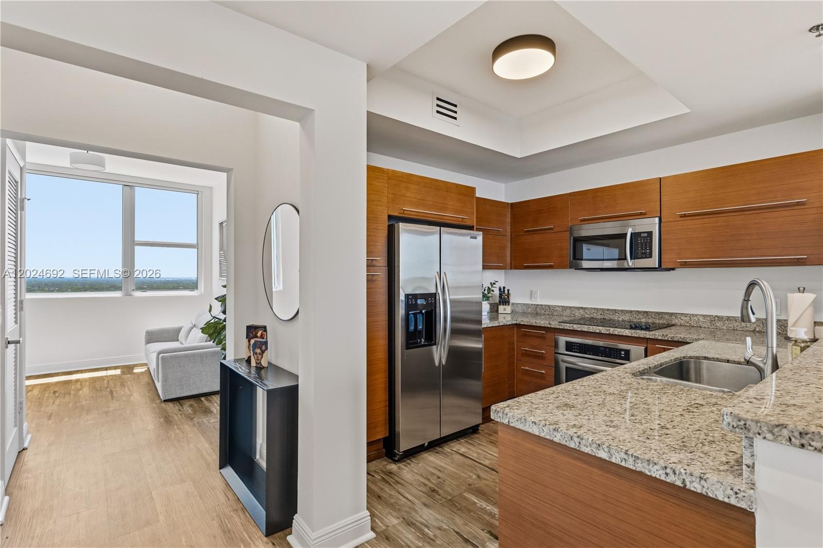 2641 North Flamingo Road, Unit 2605N Sunrise, FL 33323 - Photo 3 of 56 a kitchen with stainless steel appliances granite countertop a sink stove and refrigerator