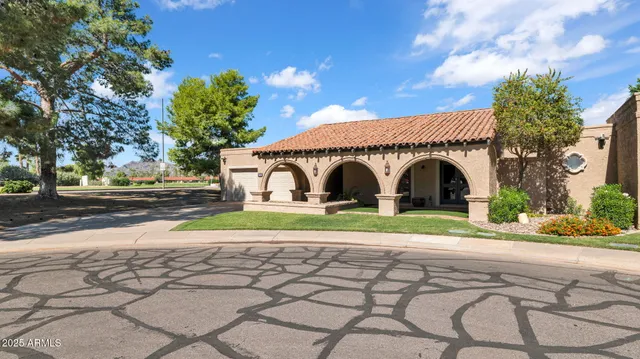 a front view of a house with garden and porch