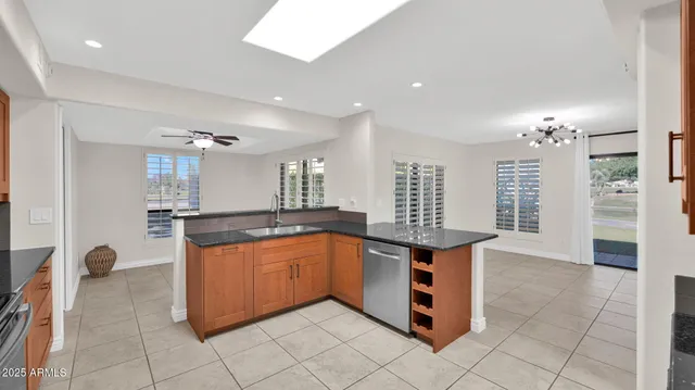 a kitchen with stainless steel appliances granite countertop a sink and cabinets
