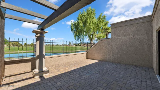 a view of a yard with porch and wooden floor
