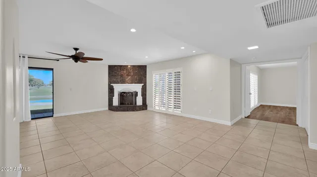 a view of an empty room and fire place