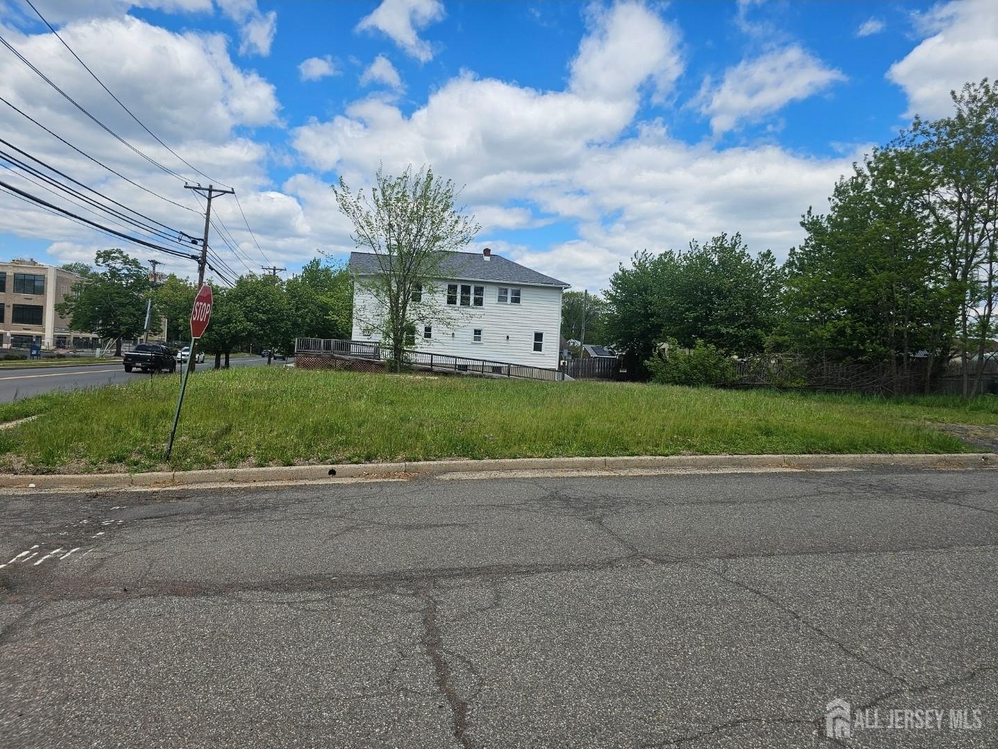 115 Stelton Road Piscataway, NJ 08854 - Photo 4 of 4 a view of a big house in a big yard with large trees
