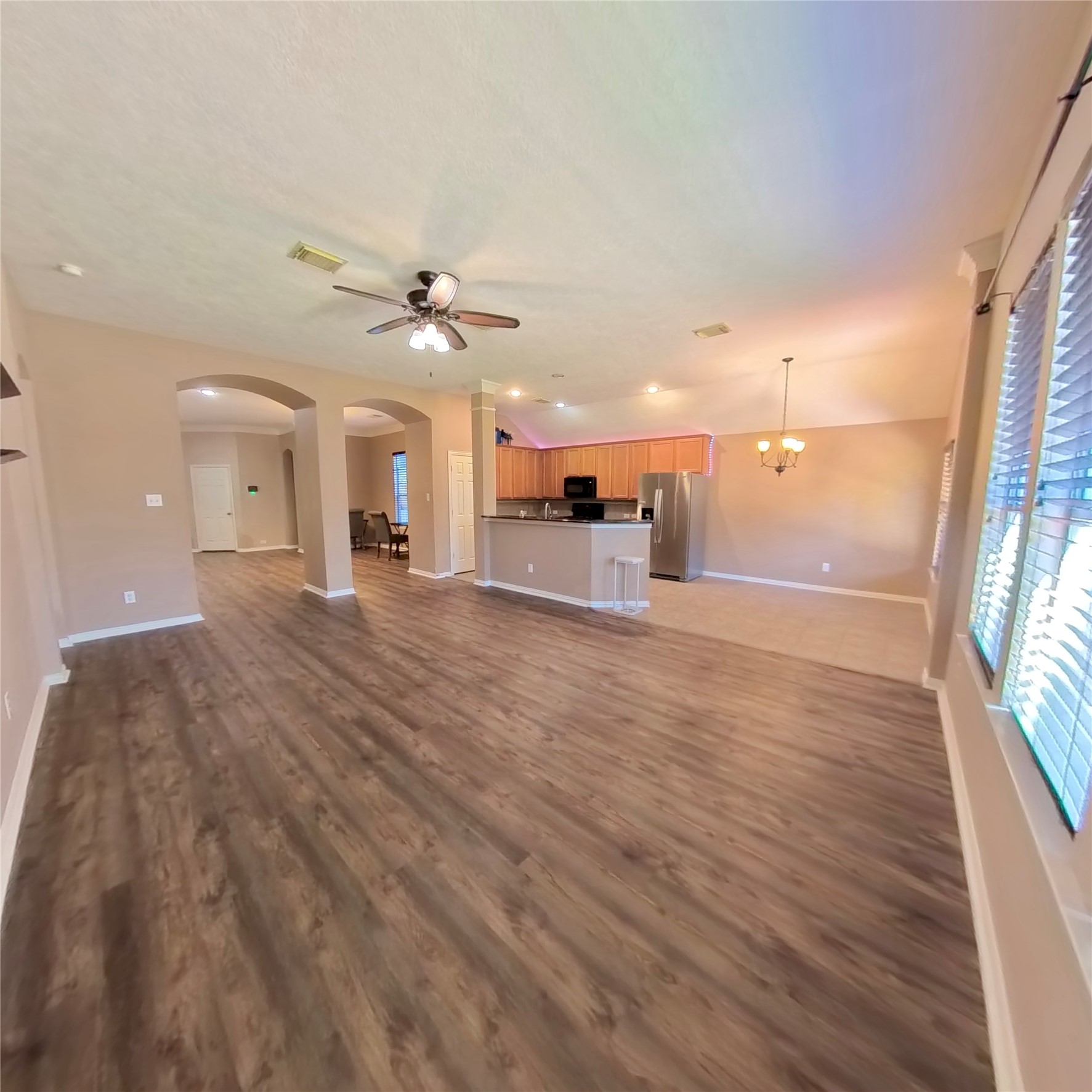 30938 Blue Ridge Park Lane Spring, TX 77386 - Photo 22 of 32 wooden floor in an empty room with a window