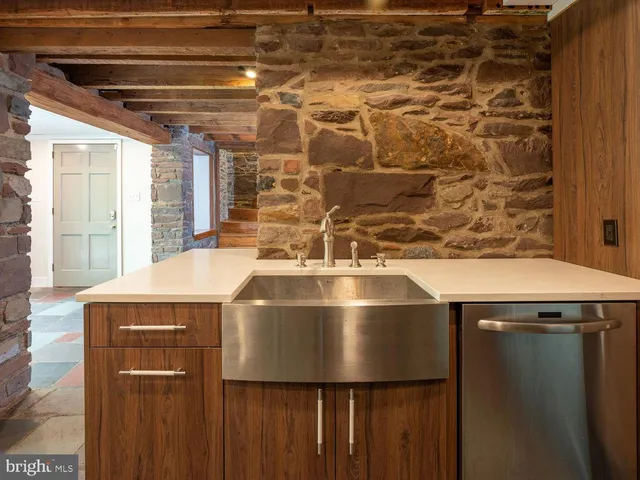 a bathroom with a double vanity sink mirror and shower