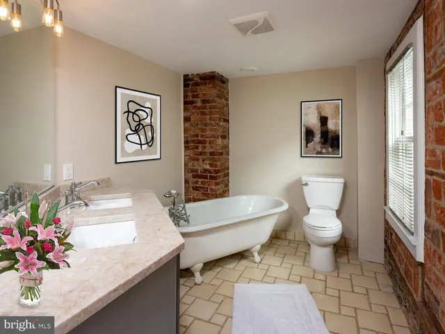 a bedroom with a bed and a walk in closet