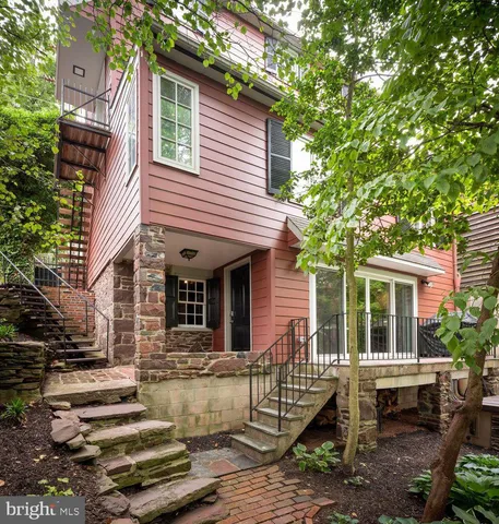 a view of brick house with large windows