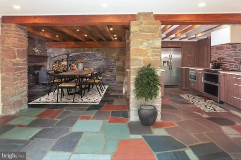 a kitchen with stainless steel appliances granite countertop a stove and a sink