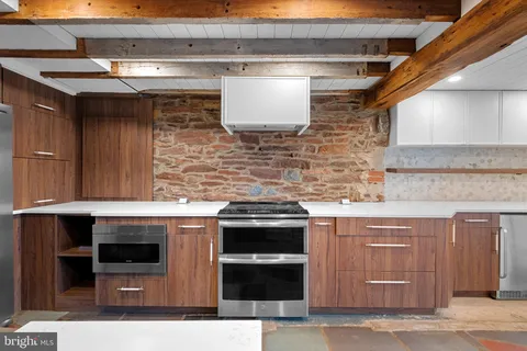 a backyard of a house with outdoor seating