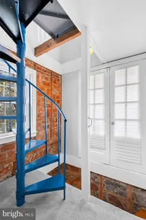 a bedroom with a bed and a walk in closet