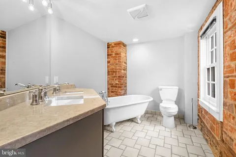 a bedroom with a bed and furniture