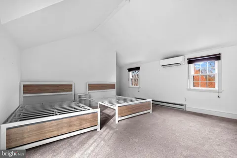 a front view of a house with a street