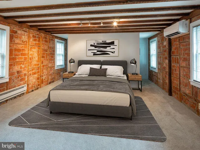 a spacious bedroom with a bed and walk in closet