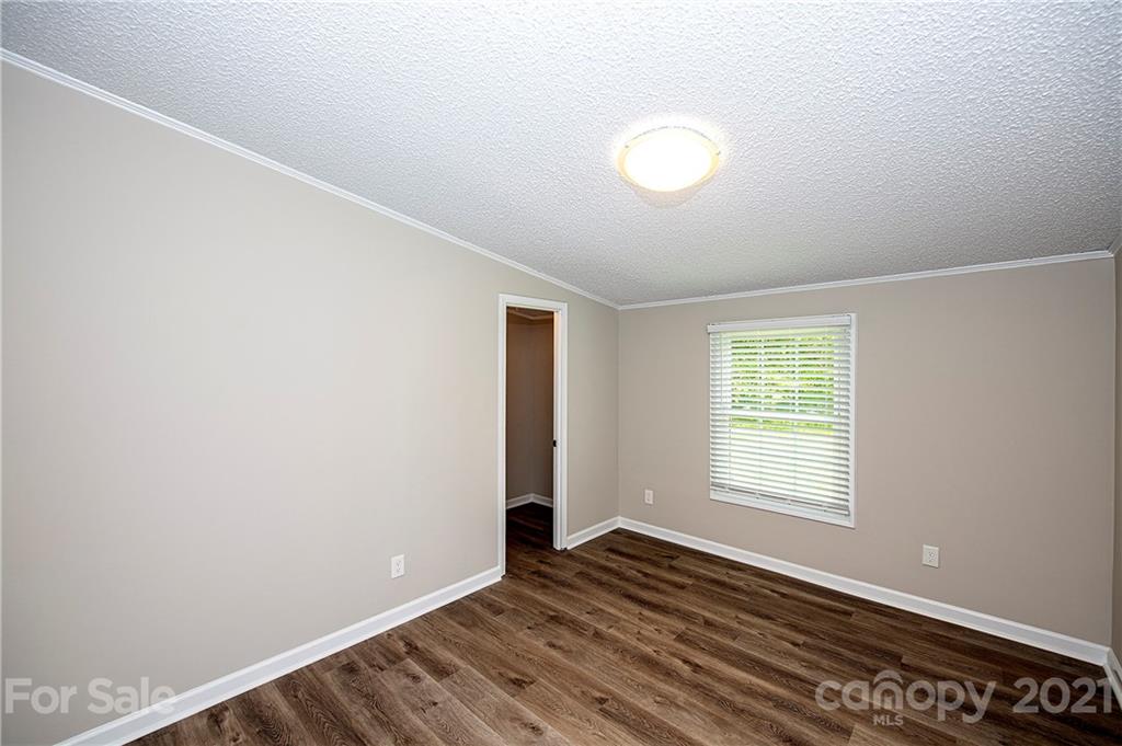 1844 Reservation Road Rock Hill, SC 29730 - Photo 22 of 28 an empty room with wooden floor and windows