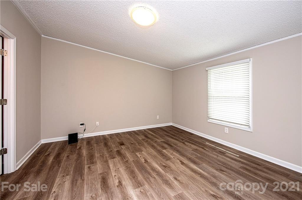 1844 Reservation Road Rock Hill, SC 29730 - Photo 8 of 28 an empty room with wooden floor and windows