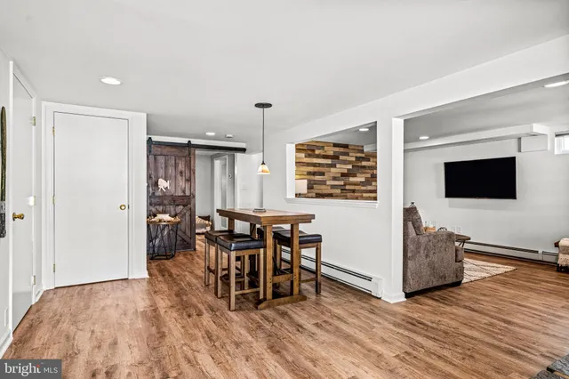 a view of a livingroom with furniture and wooden floor