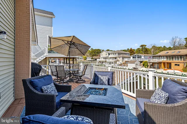 a view of a city from a dining room with furniture