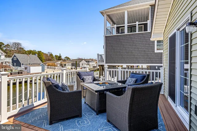 a view of a chairs and table in the balcony