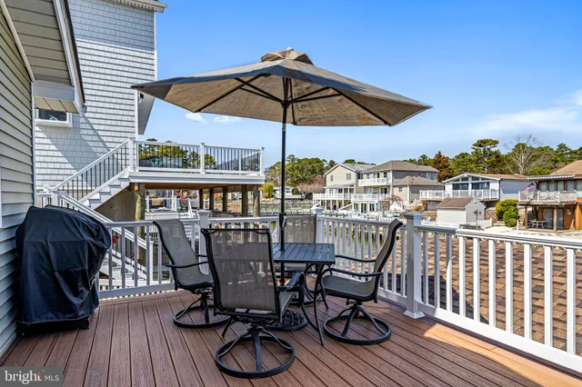 a view of balcony with furniture and wooden floor