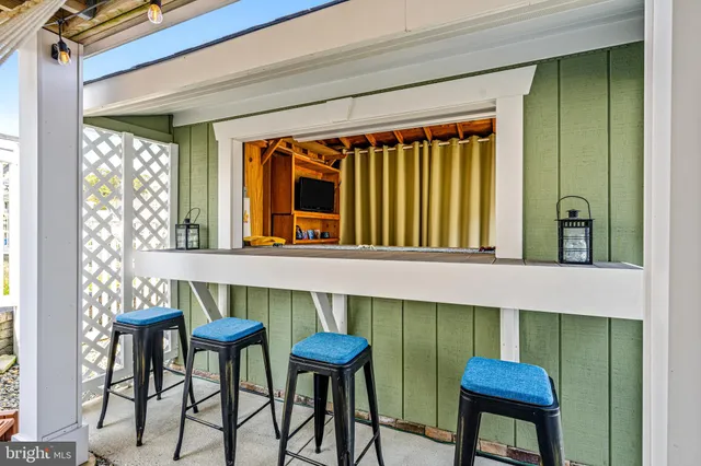 a table and chairs in front of a window