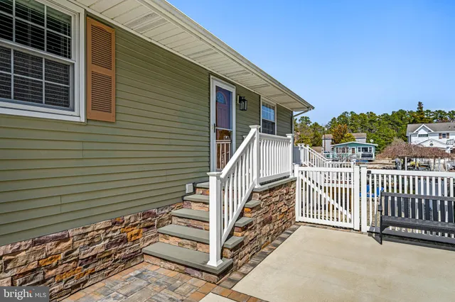 a view of a house with wooden fence
