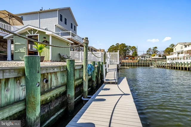 a view of a brick building next to a lake