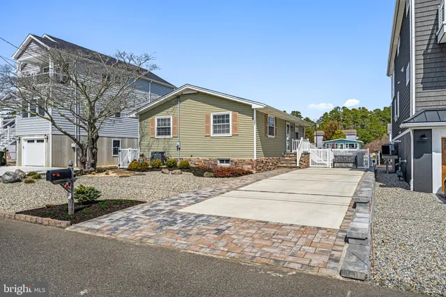 an aerial view of a house with outdoor space