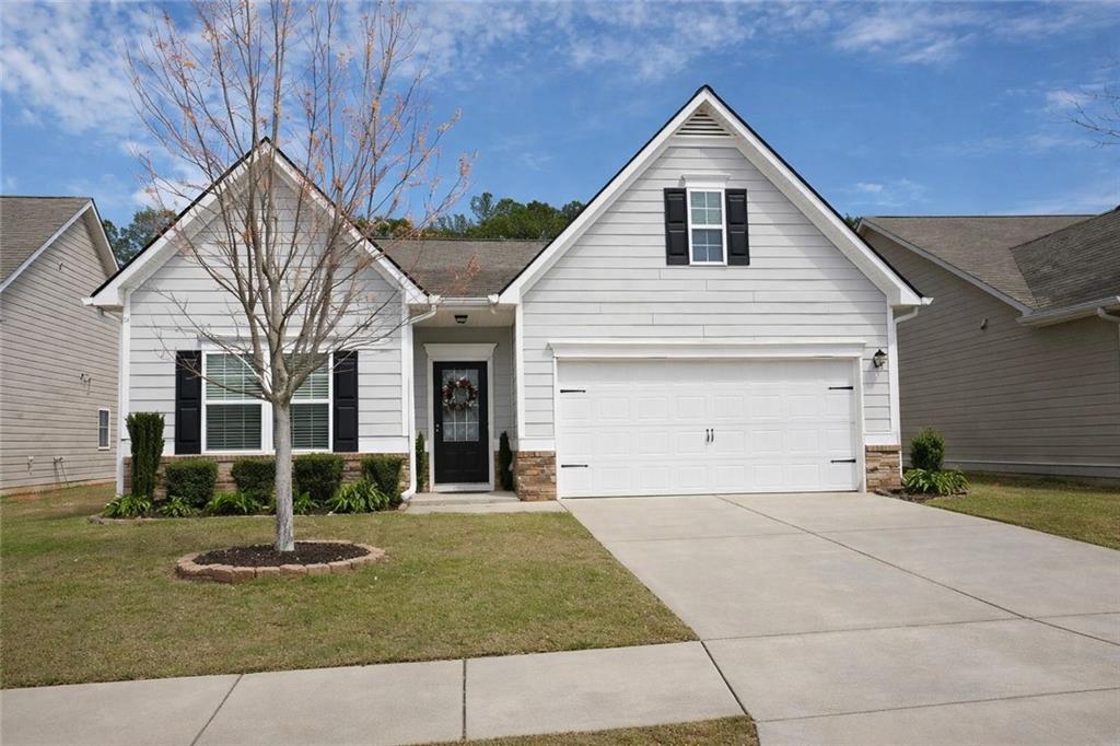 104 Thomaston Street Newnan, GA 30263 - Photo 1 of 1 a front view of a house with a yard
