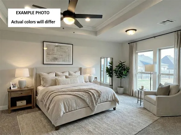 a bedroom with a large bed and a large window