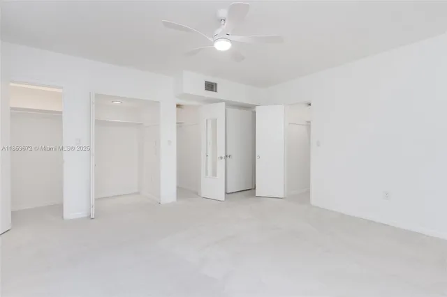 a bathroom with a sink mirror toilet and shower