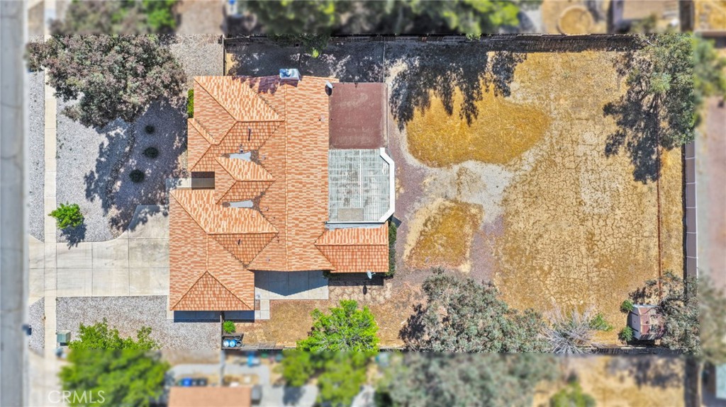 20403 Ochoa Road Apple Valley, CA 92307 - Photo 45 of 48 aerial view of a house with a yard and large trees