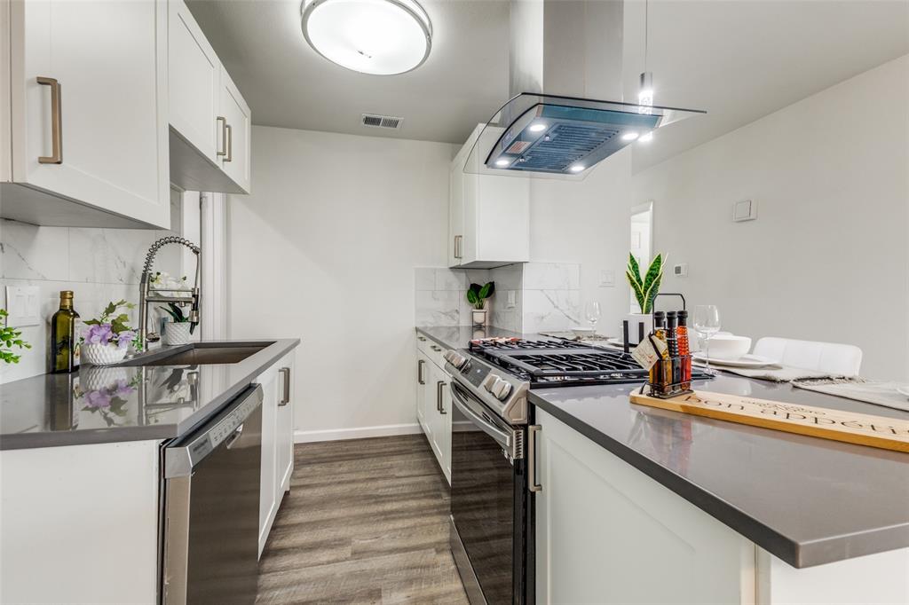 1705 Magnolia Drive Mesquite, TX 75149 - Photo 1 of 24 a kitchen with stainless steel appliances granite countertop a stove and a sink