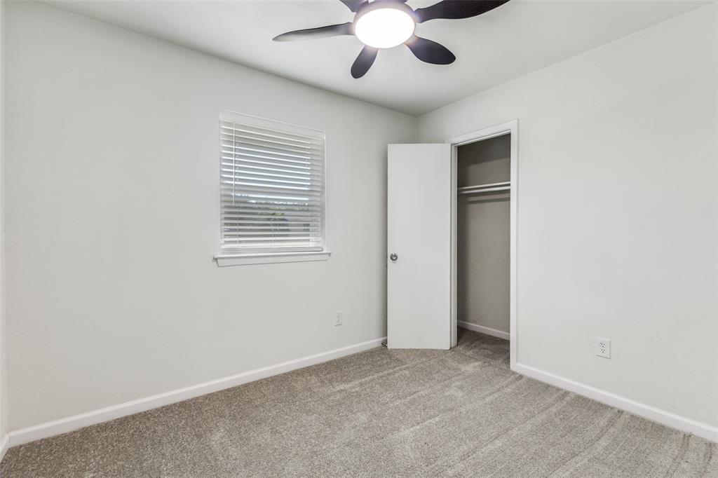 1705 Magnolia Drive Mesquite, TX 75149 - Photo 15 of 24 an empty room with chandelier fan and windows