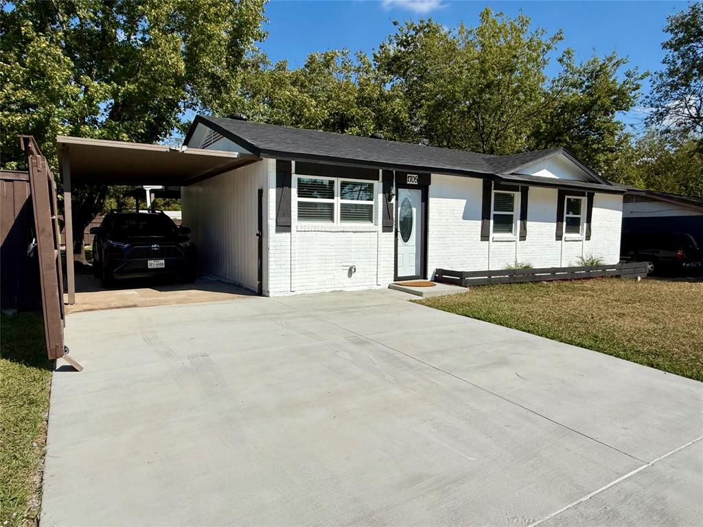 1705 Magnolia Drive Mesquite, TX 75149 - Photo 3 of 24 a front view of a house with a yard