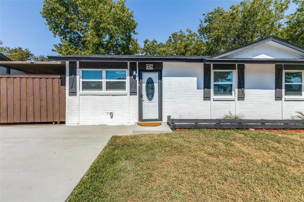 1705 Magnolia Drive Mesquite, TX 75149 - Photo 4 of 24 a front view of a house with garden