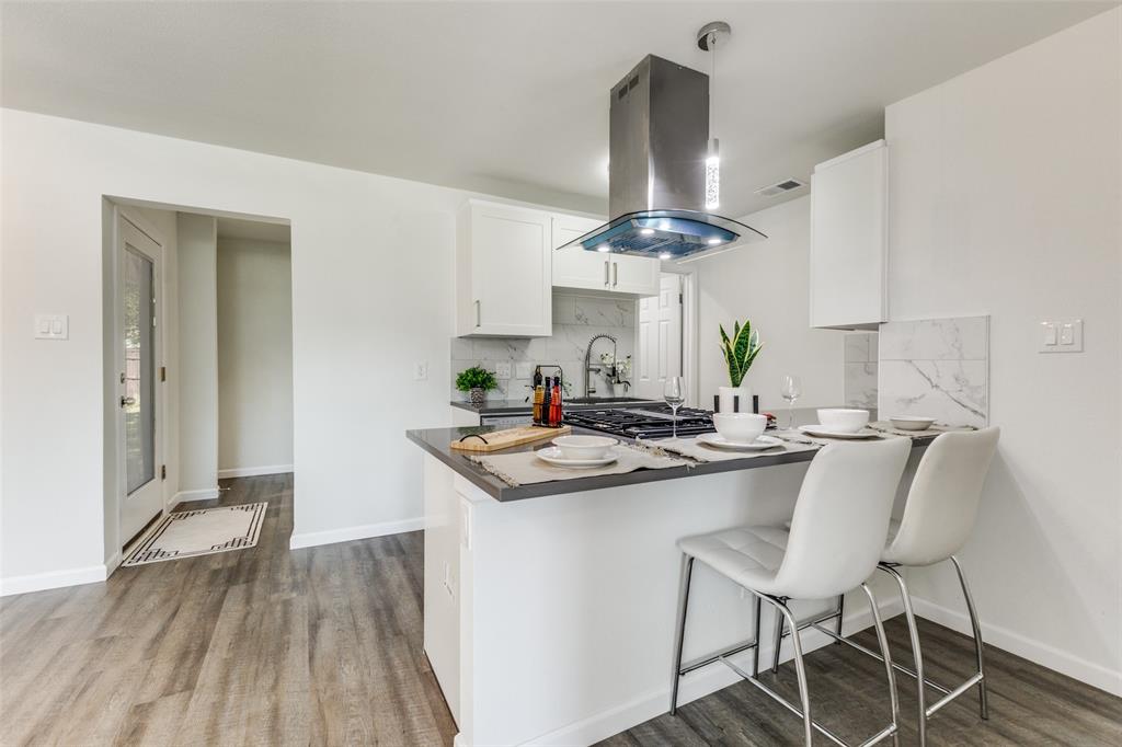 1705 Magnolia Drive Mesquite, TX 75149 - Photo 10 of 24 a kitchen with a sink and stove top oven