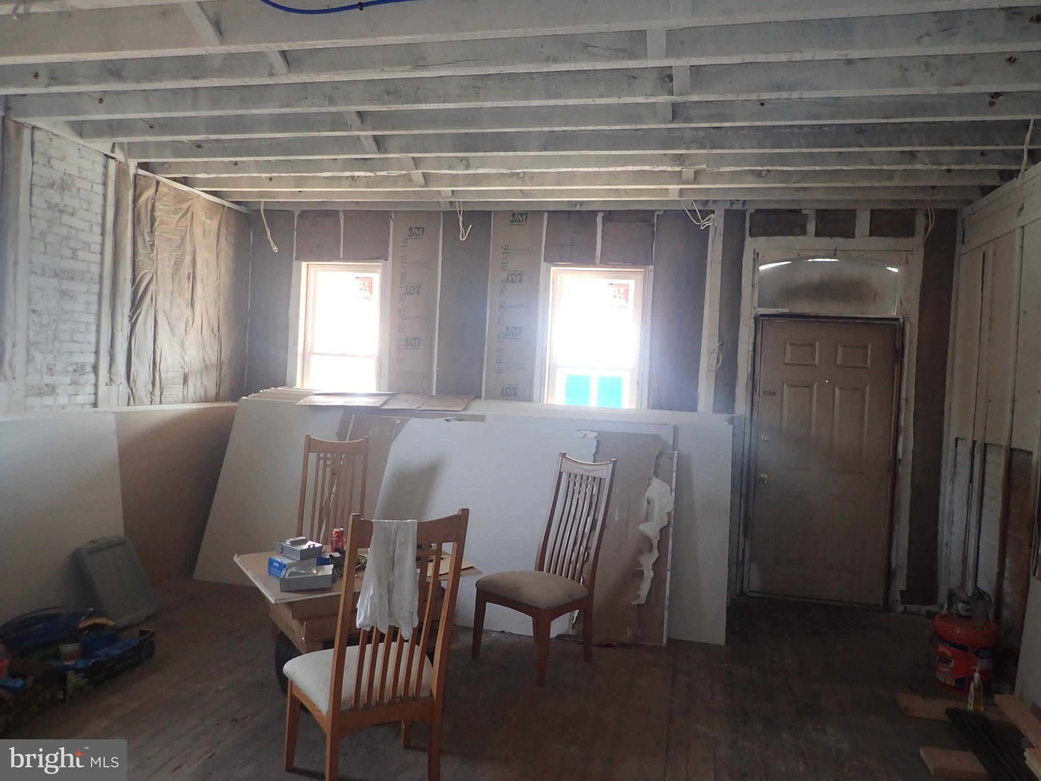 1402 West 3rd Street Chester, PA 19013 - Photo 4 of 11 a view of a dining room with furniture and window