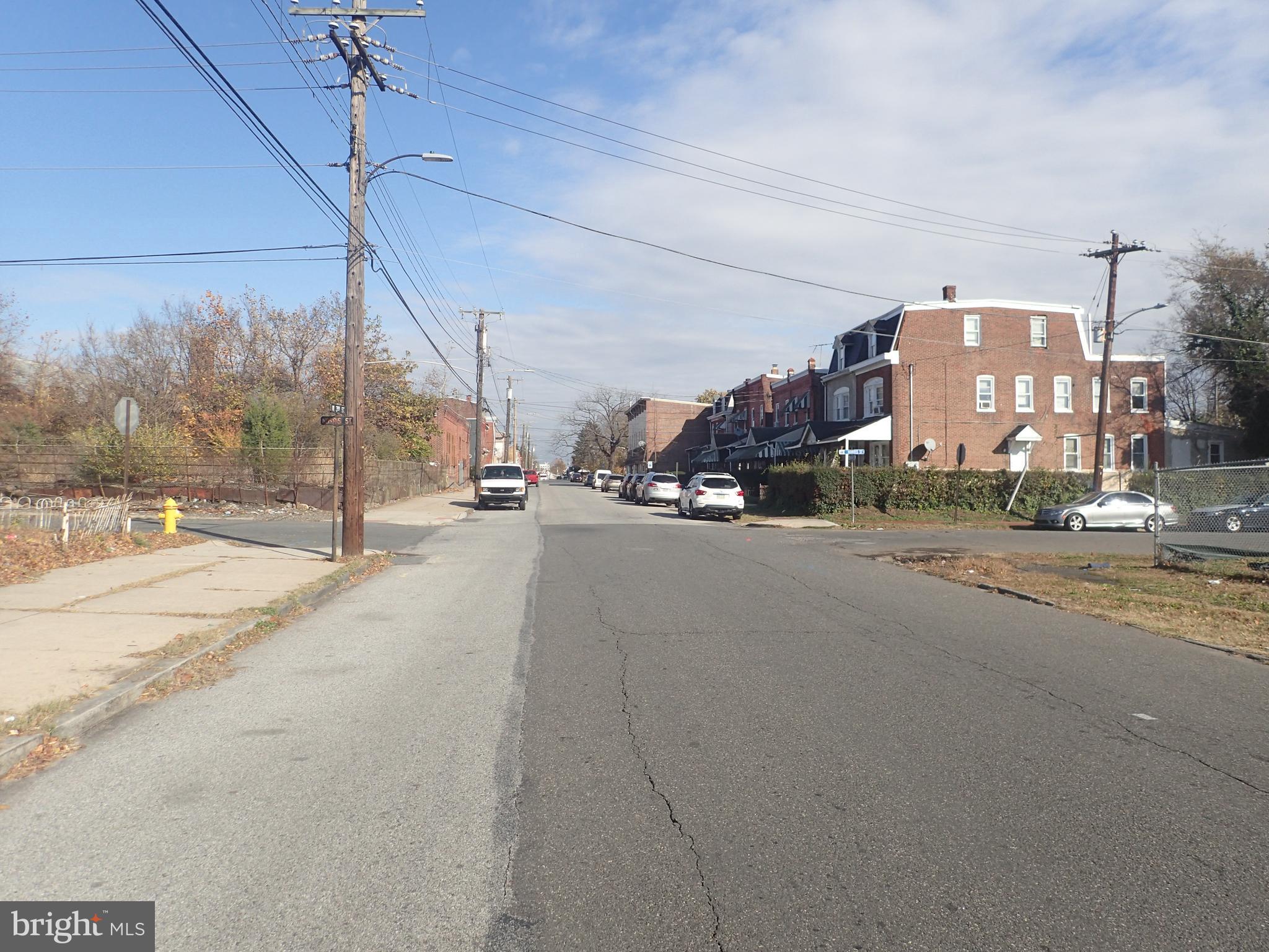 1402 West 3rd Street Chester, PA 19013 - Photo 9 of 11 a view of a street with a building in the background