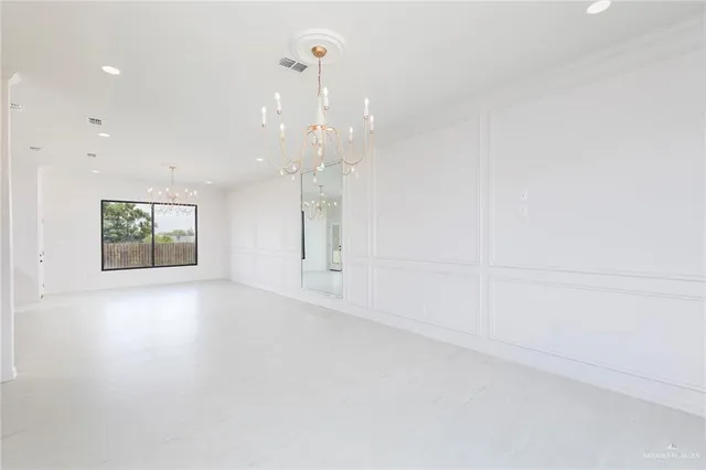 an empty room with a empty space and windows