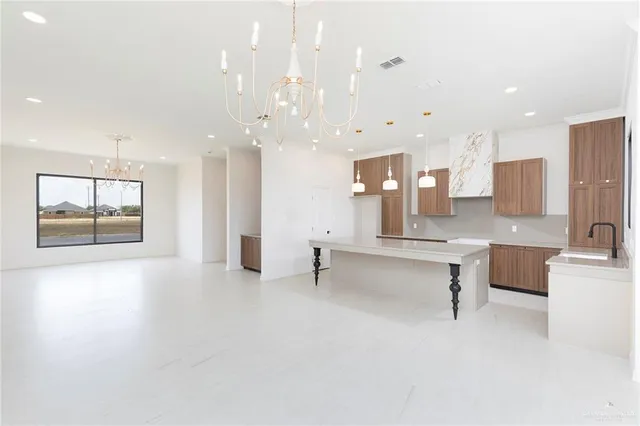 a large room with a large window and chairs