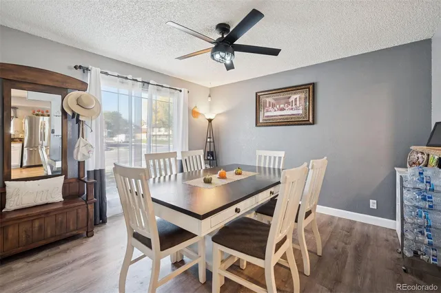 a dining room with furniture and window