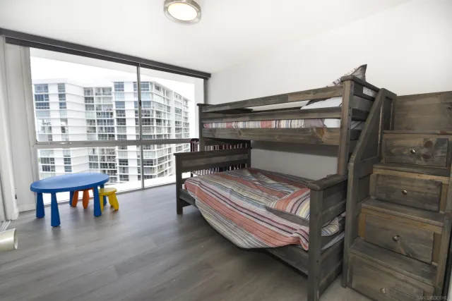 a bedroom with furniture and a window
