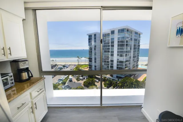 a kitchen with a stove a faucet and a refrigerator