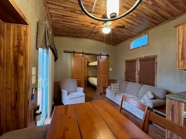 a bedroom with furniture and a chandelier