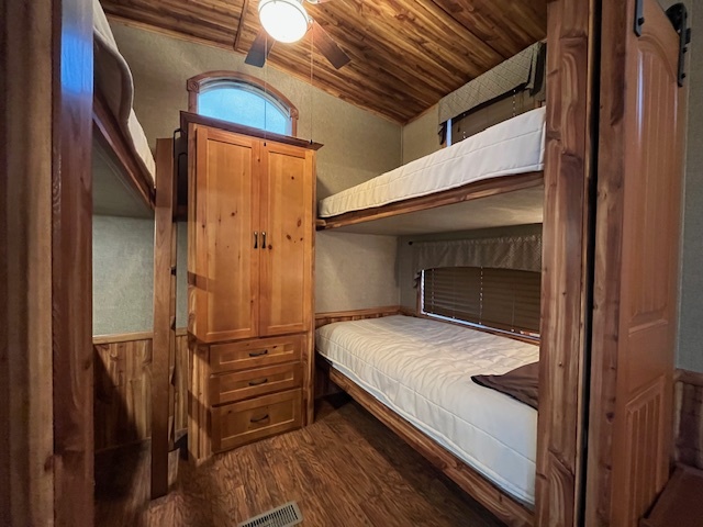 2795 East 28th Road Marseilles, IL 61341 - Photo 18 of 58 a bedroom with a bed and wooden floor