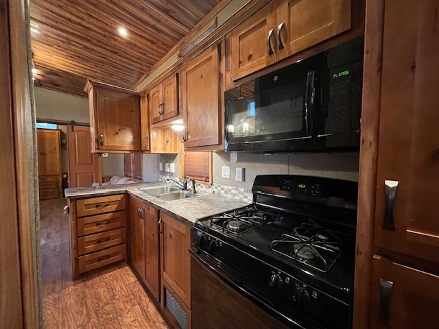 2795 East 28th Road Marseilles, IL 61341 - Photo 8 of 58 a kitchen with a stove and a microwave