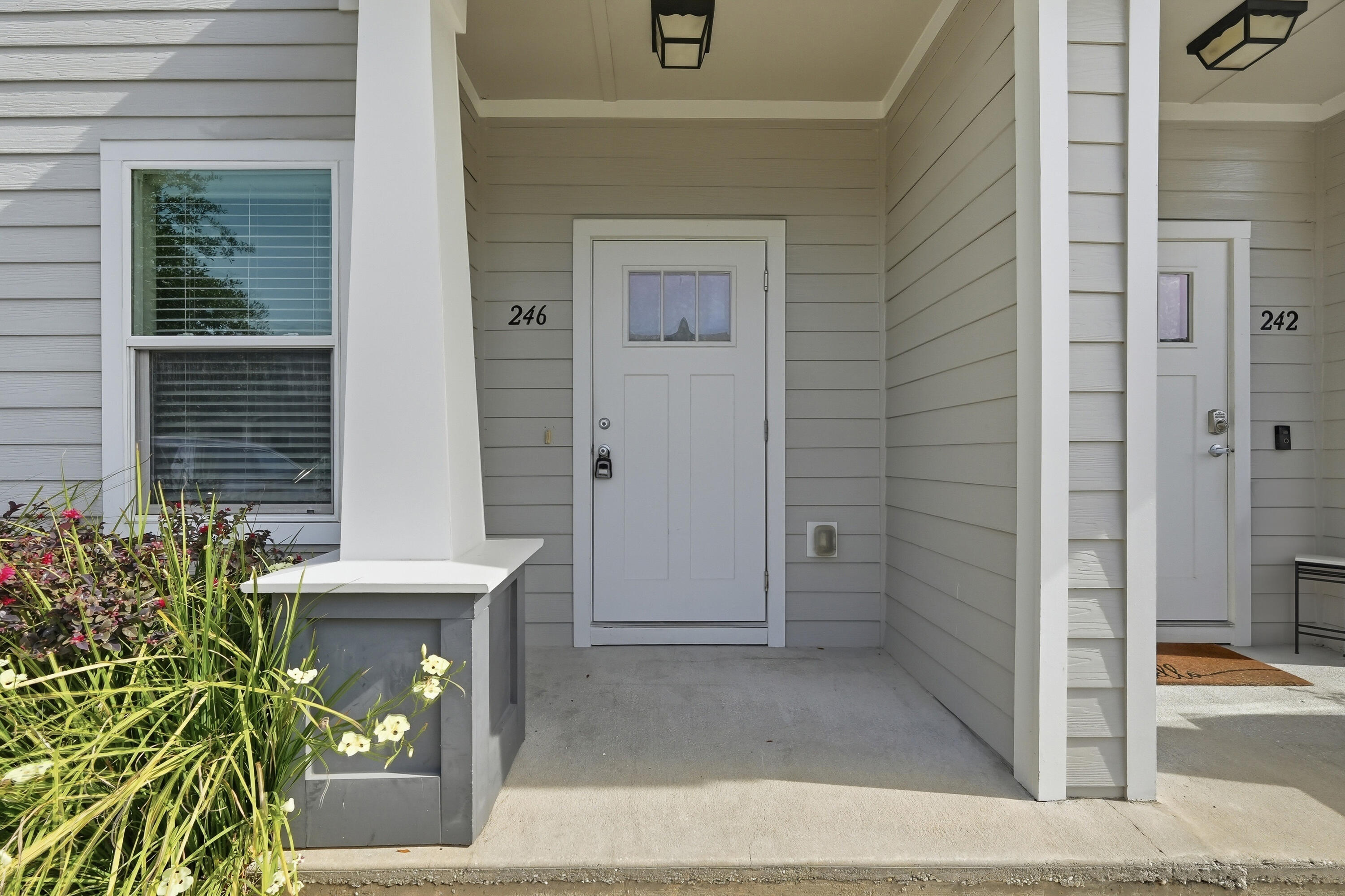 front view of a house with a potted plant