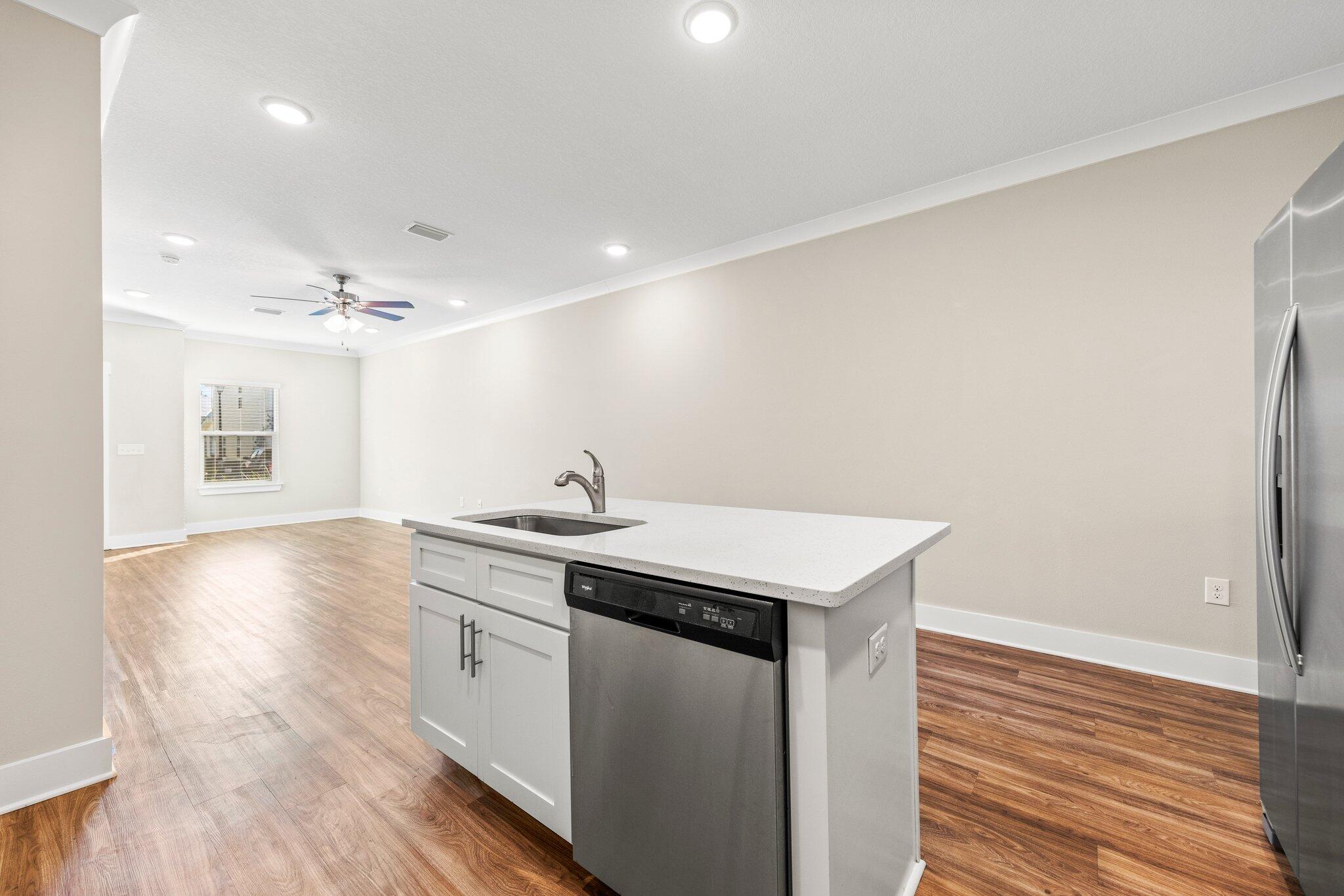 246 North Sand Palm Road Freeport, FL 32439 - Photo 12 of 36 a kitchen with a sink cabinets and wooden floor