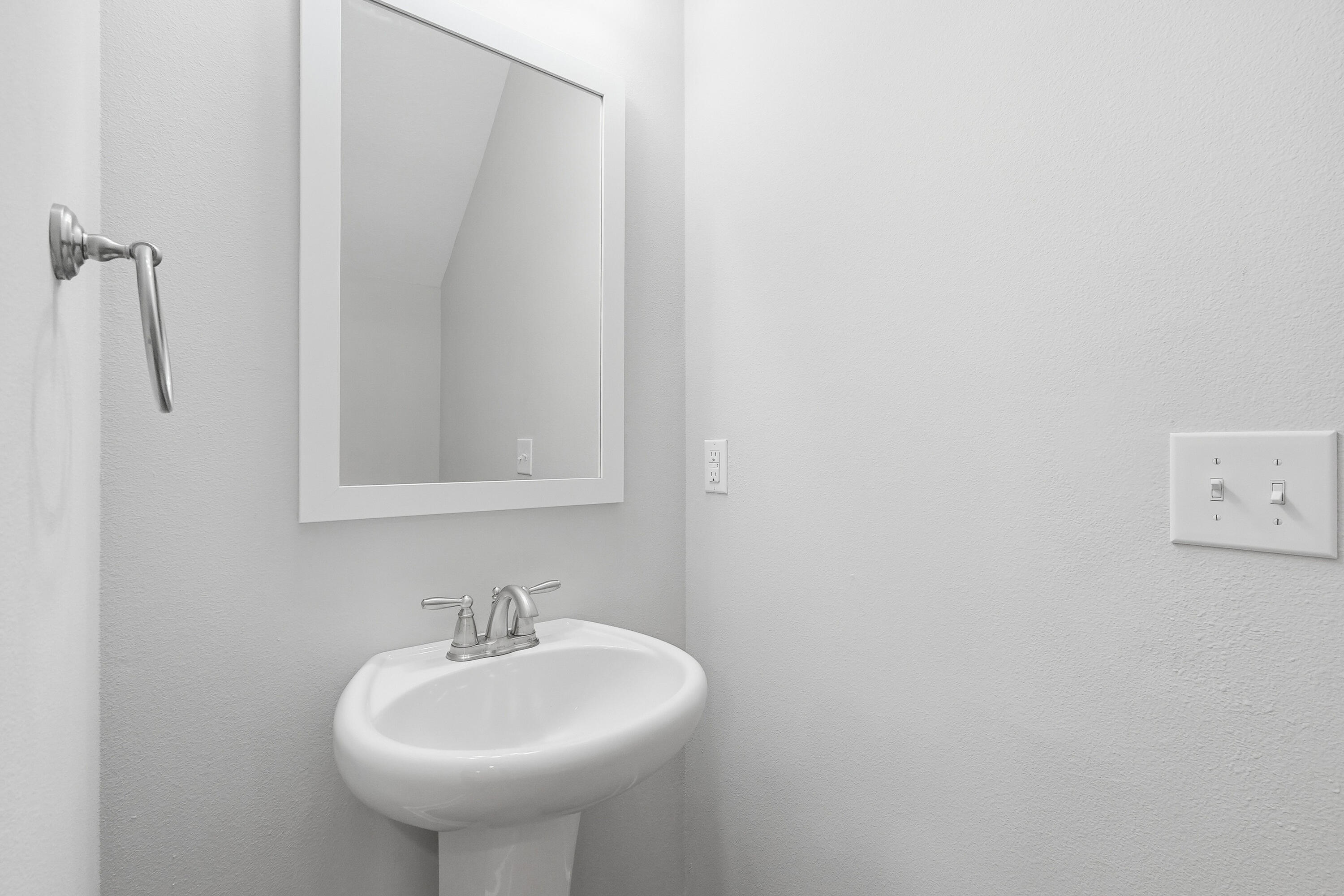 246 North Sand Palm Road Freeport, FL 32439 - Photo 16 of 42 a bathroom with a sink and a mirror