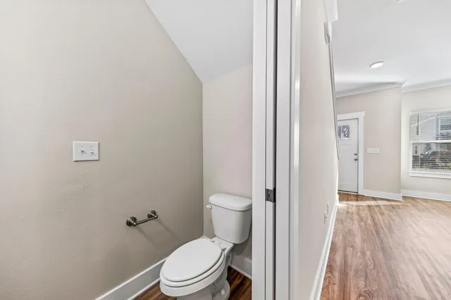 a white toilet sitting next to a bathroom sink