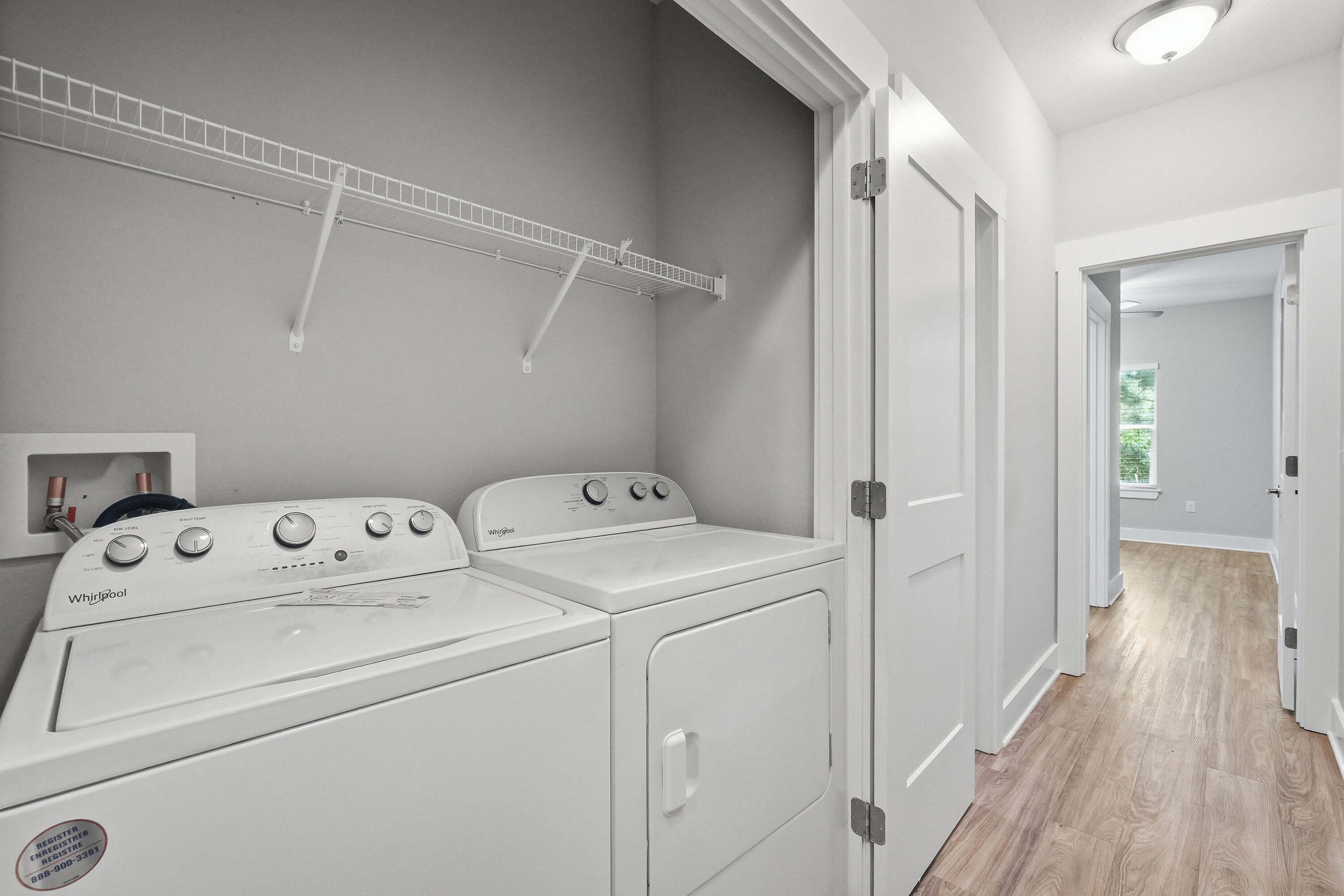 246 North Sand Palm Road Freeport, FL 32439 - Photo 19 of 42 a view of storage and utility room with washer and dryer